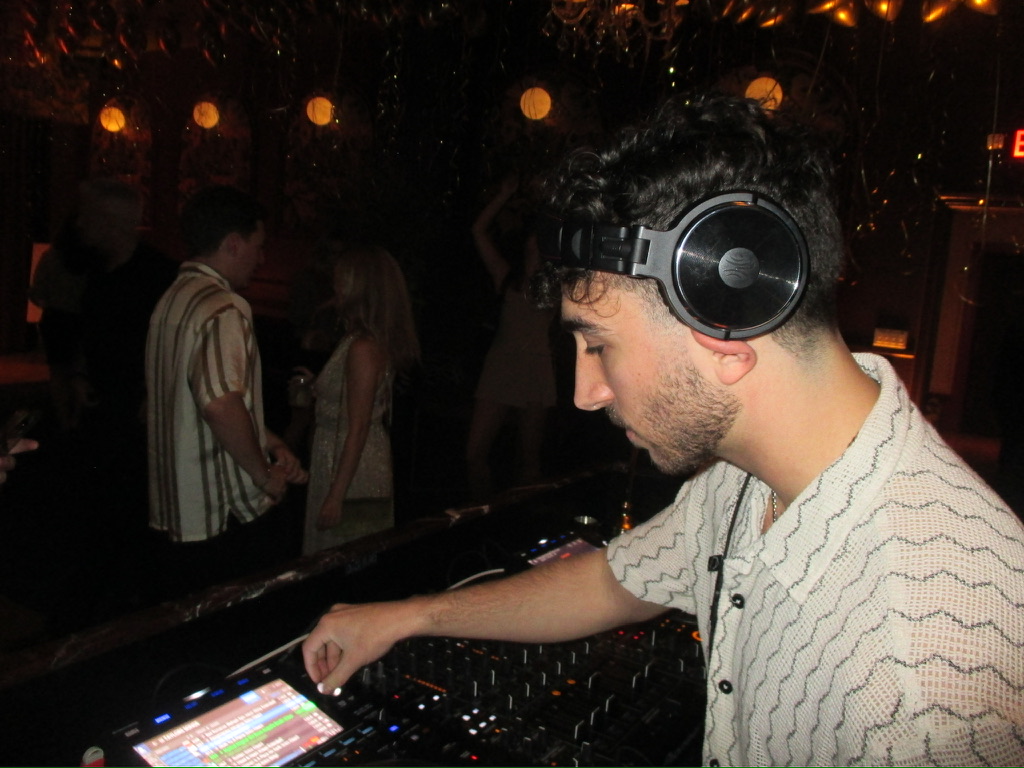 DJ mixing on a controller at a live Masjedi Events gig